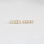 Hand Engraved By Rhode Island Jeweler, Corkie Bolton. This image is of 18k yellow gold bar studs with four diamonds in each earring.