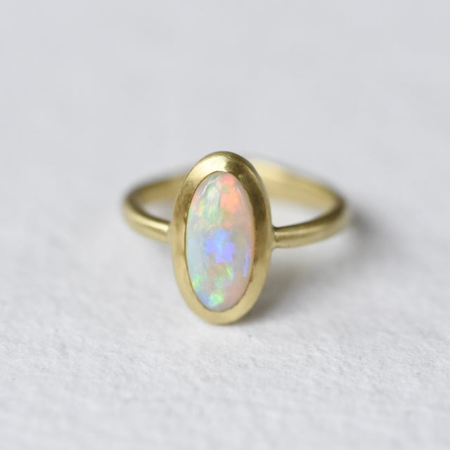 Australian opal 18k yellow gold ring with accent diamond by Corkie Bolton Jewelry.