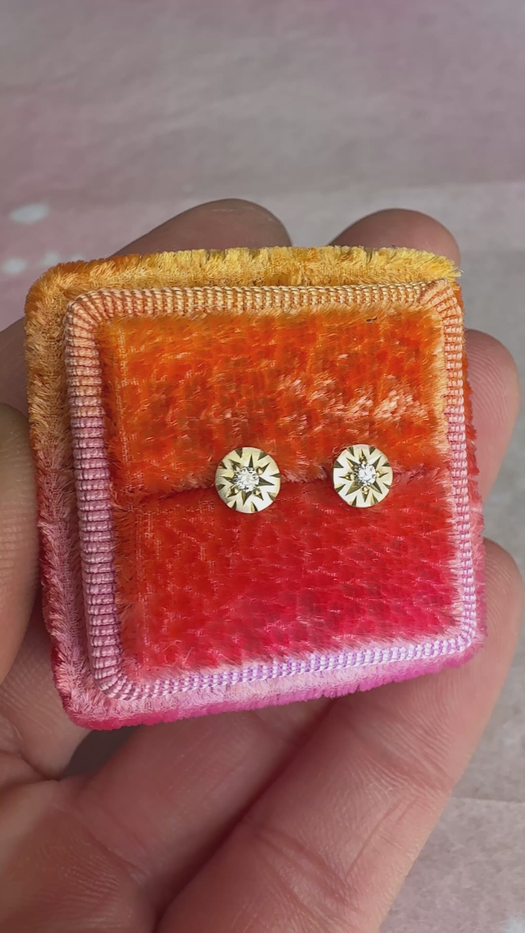 Video showcasing Funfetti Engraved Diamond 14k studs up close, with light catching the engraved details and diamonds.