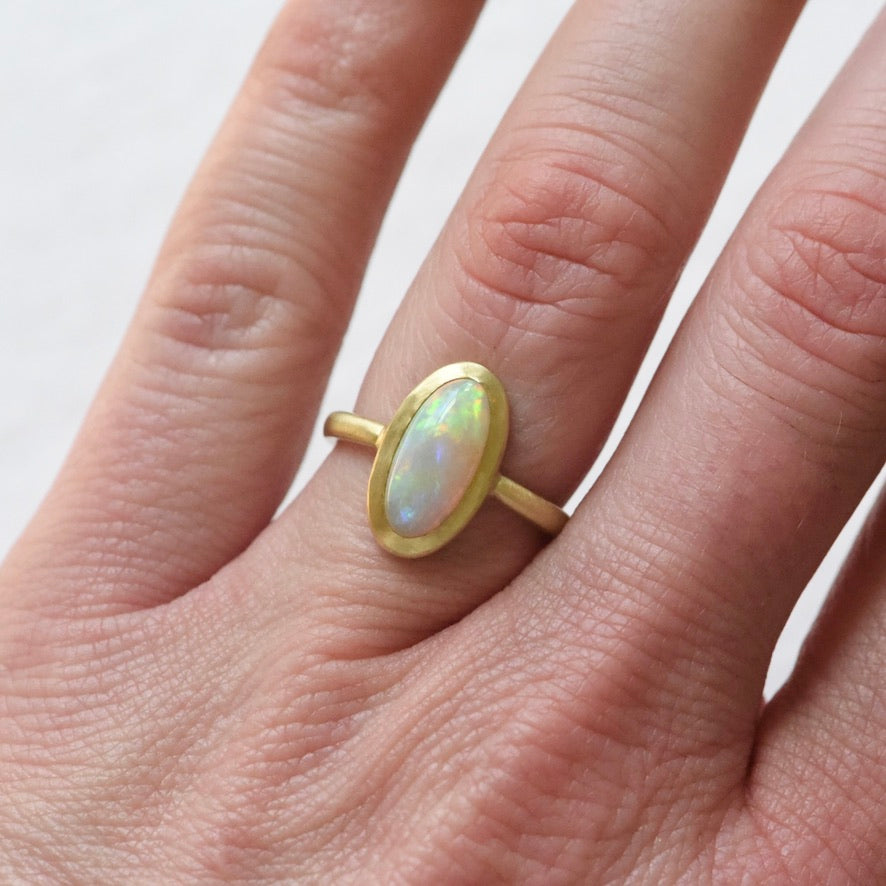 Australian opal 18k yellow gold ring with accent diamond by Corkie Bolton Jewelry.