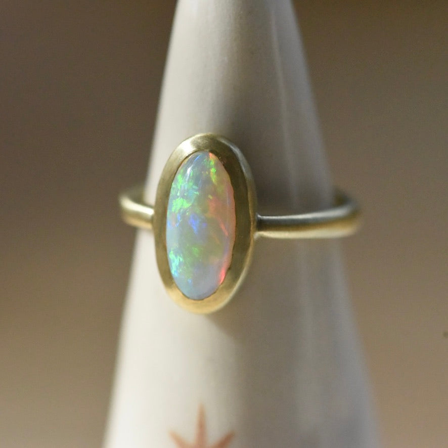 Australian opal 18k yellow gold ring with accent diamond by Corkie Bolton Jewelry.