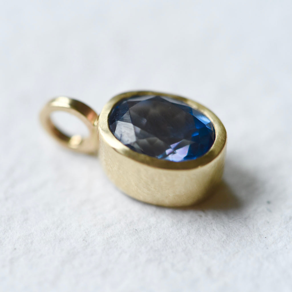 Blue Topaz Gold Charm by Corkie Bolton Jewelry