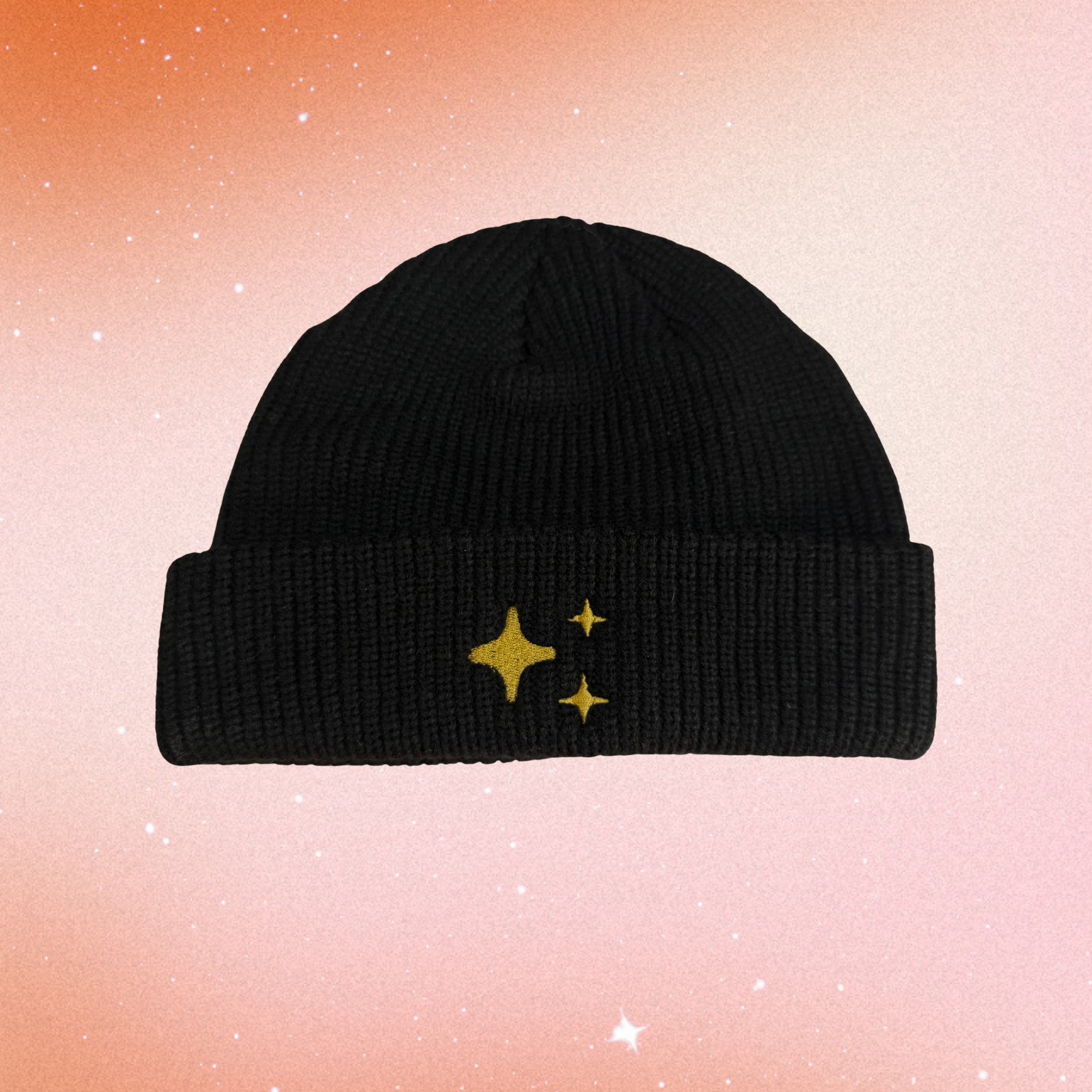 Sparkle Fisherman Beanie by Corkie Bolton Jewelry, featuring thick ribbed knit acrylic fabric with subtle gold-thread embroidery. A cozy, slightly snug fisherman-style beanie that adds a shimmer of sparkle while supporting independent artists. Gradient star background.
