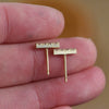 Side angle of Hand Engraved Diamond Bar Studs in 18K by Corkie Bolton Jewelry