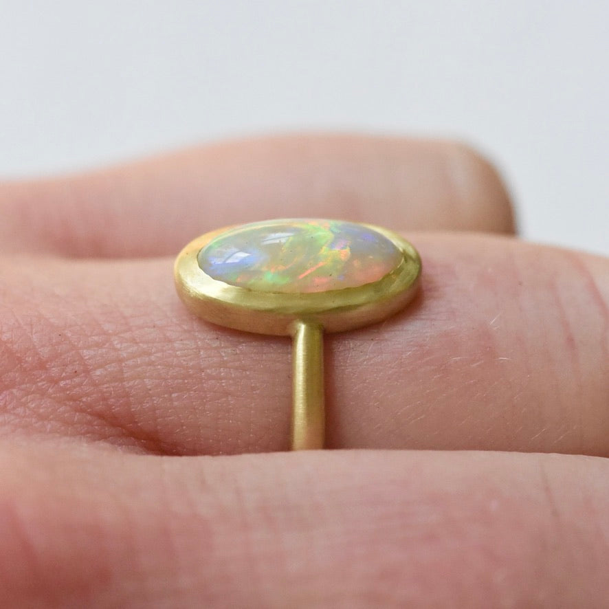 Australian opal 18k yellow gold ring with accent diamond by Corkie Bolton Jewelry.