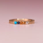 One of a kind 10k yellow gold ring with Sleeping Beauty turquoise, blue sapphire, orange sapphire, peach and white diamonds in hand engraved castle settings