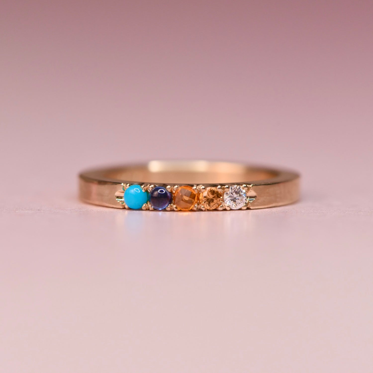 One of a kind 10k yellow gold ring with Sleeping Beauty turquoise, blue sapphire, orange sapphire, peach and white diamonds in hand engraved castle settings