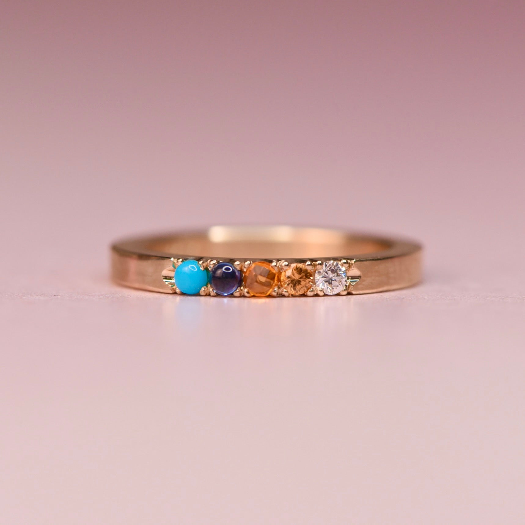 One of a kind 10k yellow gold ring with Sleeping Beauty turquoise, blue sapphire, orange sapphire, peach and white diamonds in hand engraved castle settings