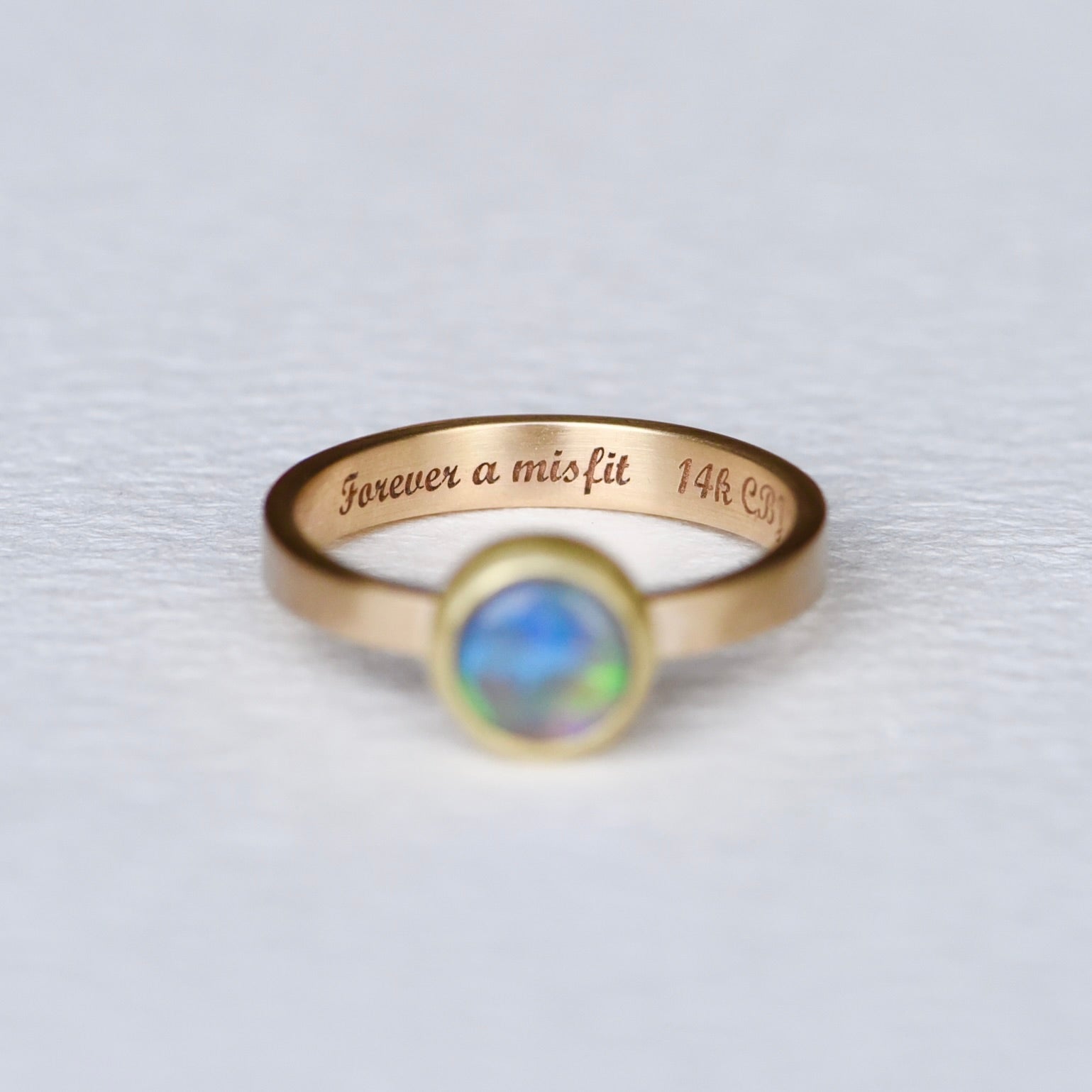 Inside laser engraving 'Forever a misfit' in script with '14K CBJ'