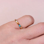 One of a kind hand engraved 10k yellow gold five stone ring with turquoise sapphire and diamond worn on hand