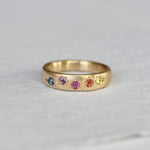 Love Is Love Sapphire Band in 14K hand engraved by Corkie Bolton Jewelry.