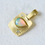 !8k yellow gold rectangular charm with a pear shaped Coober Pedy Australian Opal and diamonds. Hand engraved.