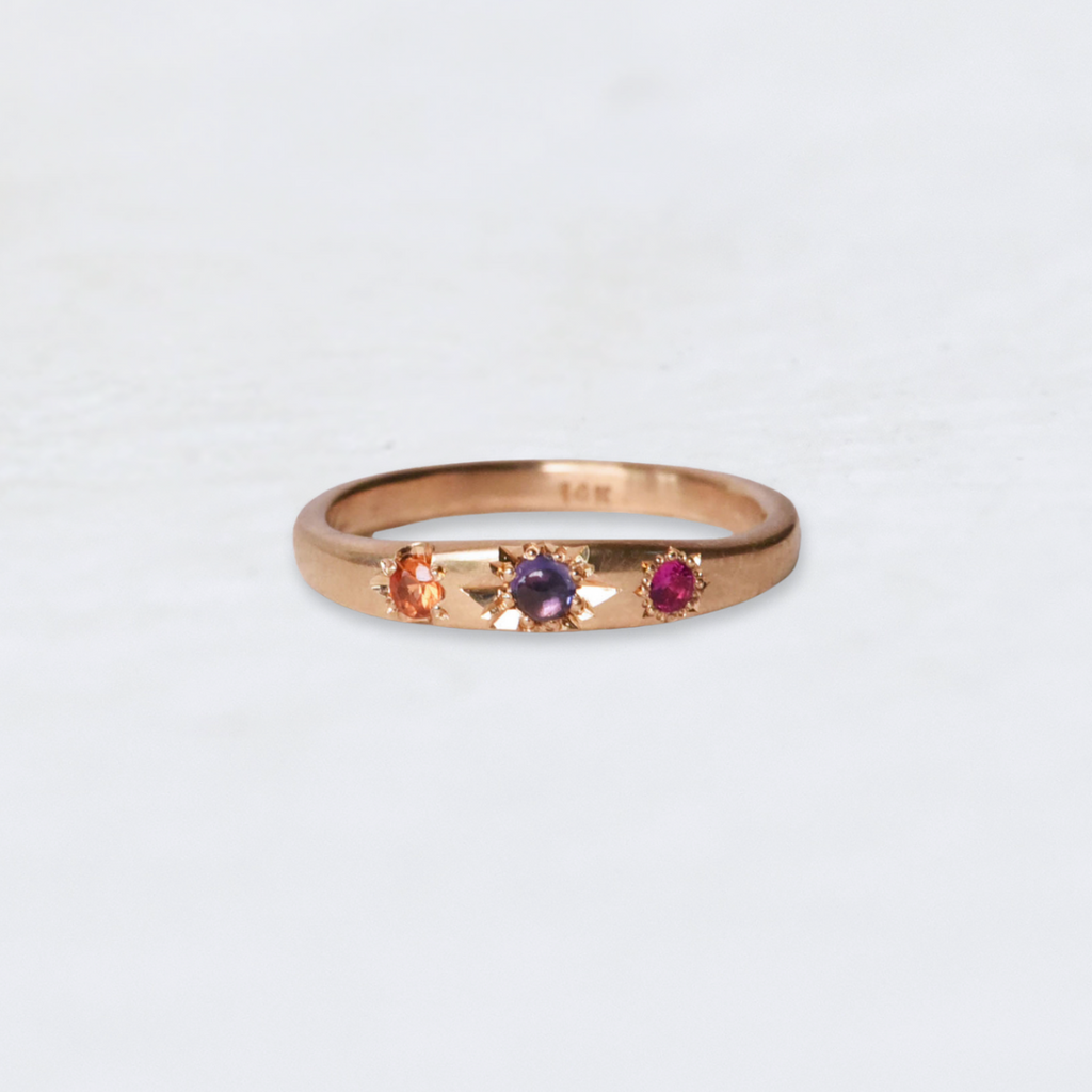 Recycled 14k Yellow Gold Ring featuring an orange, purple and pink sapphires and unique hand engraving. 