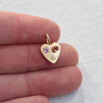 Gold heart charm, set with sapphires and a diamond. Hand engraved by Corkie Bolton.