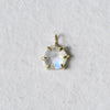 18k yellow gold six prong charm featuring moonstone.