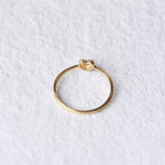 top angled of the 14k gold diamond heart ring. On a white background.