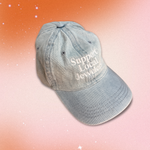 Light denim Support Local Jewelers hat with white embroidery, featuring a classic 6-panel design, adjustable strap, and soft 100% cotton construction. A relaxed, everyday cap that celebrates independent artisan jewelers.