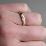 14k wide band with three star settings by Corkie Bolton Jewelry.