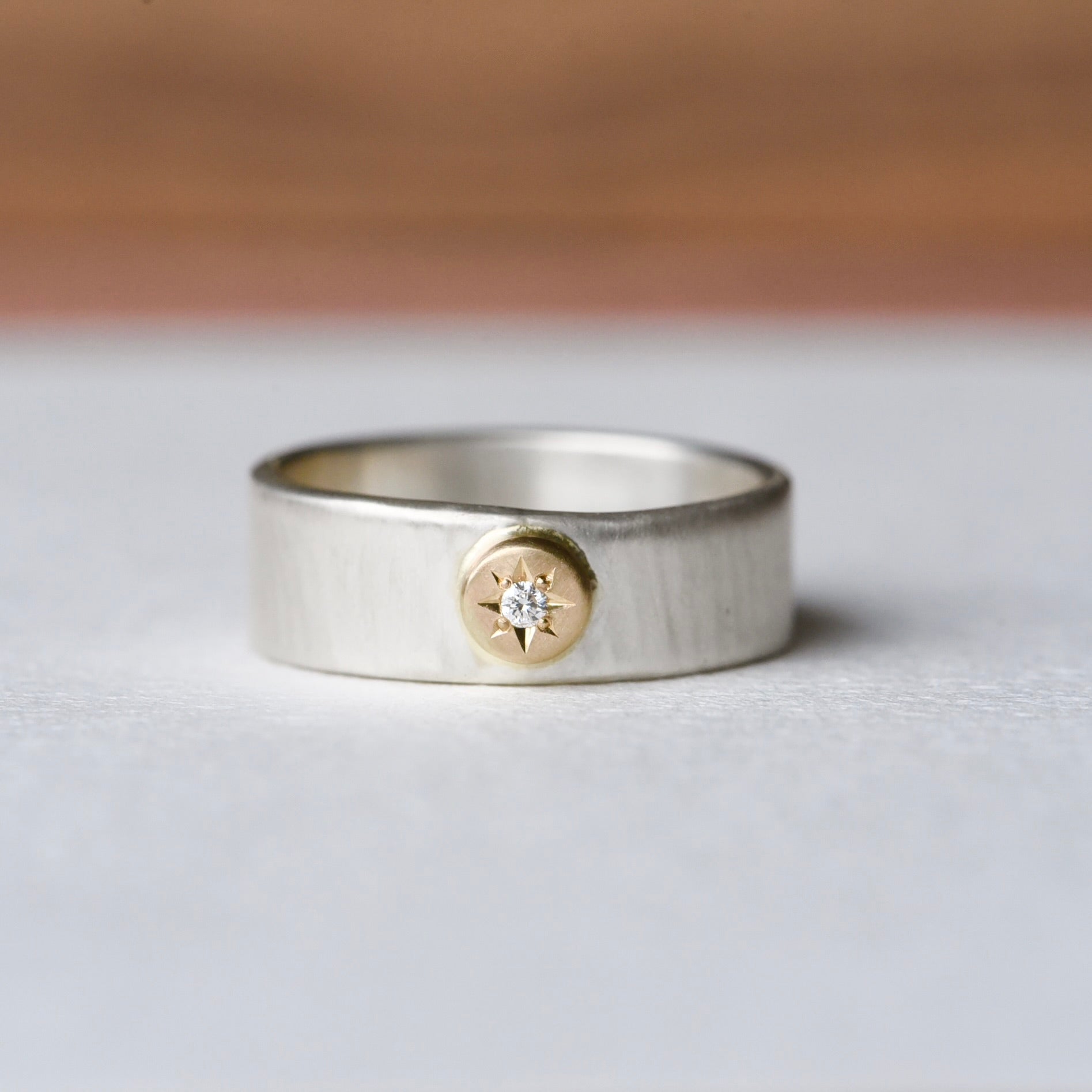 Image 1: Front view of the Waves Engraved 14k Silver Diamond Ring in size 8.5, featuring a textured wave-like band and a solid 14k gold star setting with a sparkling diamond centerpiece.