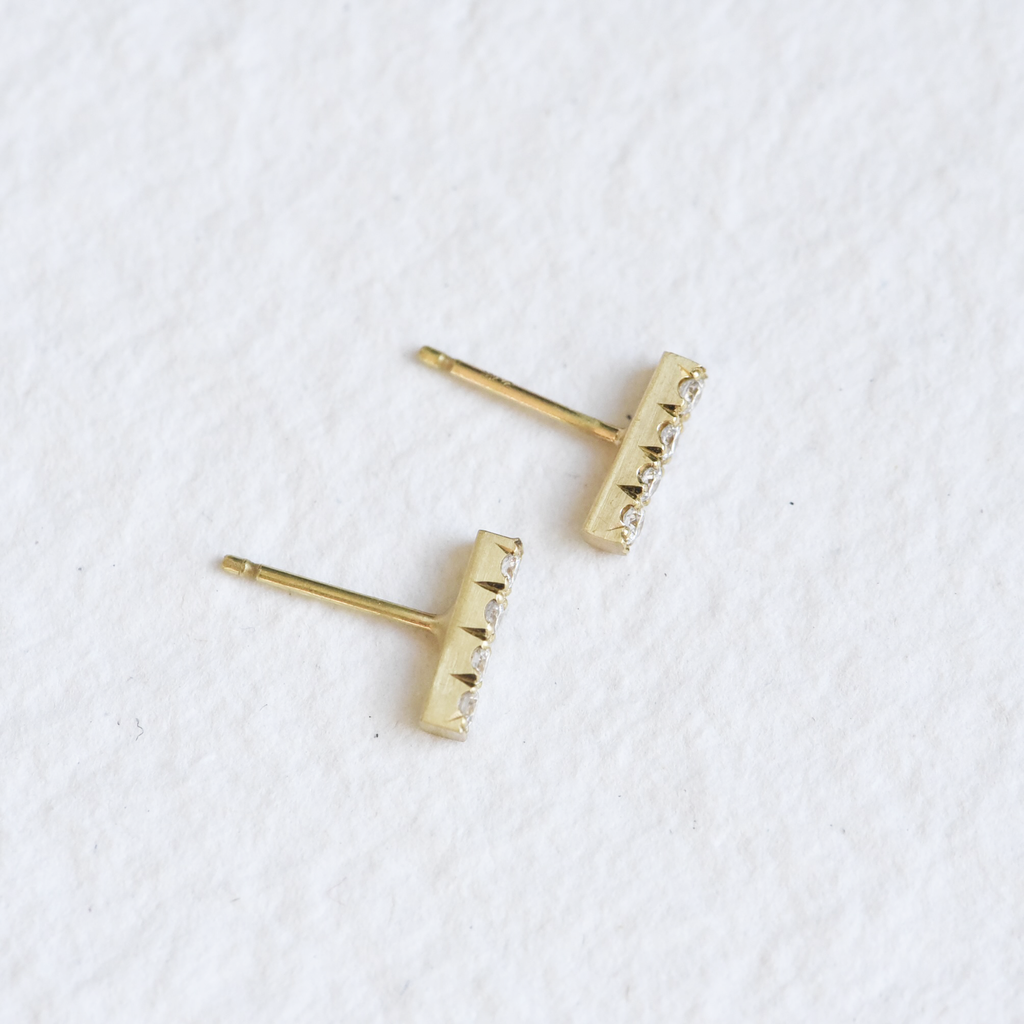 Top view of Hand Engraved Diamond Bar Studs in 18K by Corkie Bolton Jewelry