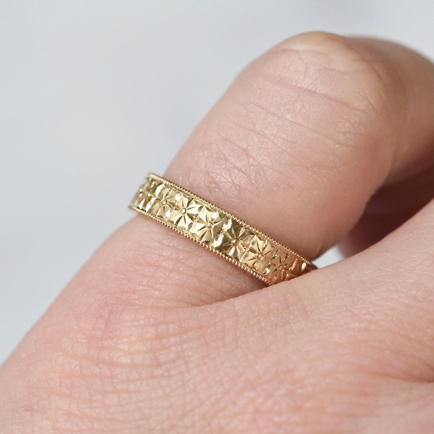 Hand engraved 14k yellow gold ring with milgrained edge by Corkie Bolton Jewelry.