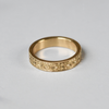 Hand engraved 14k yellow gold ring with milgrained edge by Corkie Bolton Jewelry.