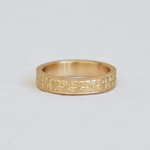 Hand engraved 14k yellow gold ring with milgrained edge by Corkie Bolton Jewelry.