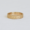 Hand engraved 14k yellow gold ring with milgrained edge by Corkie Bolton Jewelry.