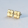 Hand engraved floral stud earrings in 18k yellow gold by Corkie Bolton Jewelry.