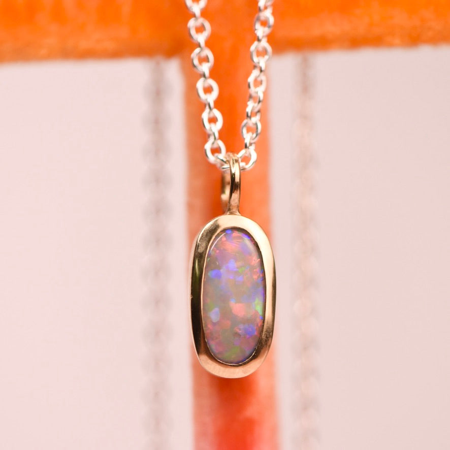 Lightning Ridge crystal opal bezel set in 22k yellow gold pendant on sterling silver cable chain, by Corkie Bolton Jewelry
