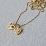 Two Misfit 14k Gold Heart Charms on a ball chain. Created by Corkie Bolton Jewelry.