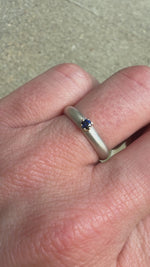 Hand modeling a petite prong-set blue sapphire ring in 14k yellow gold, one-of-a-kind design by Corkie Bolton Jewelry.