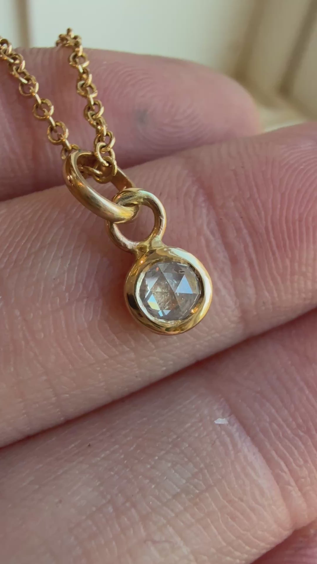Video of 14k yellow gold chain necklace with bezel-set rose cut salt and pepper diamond pendant