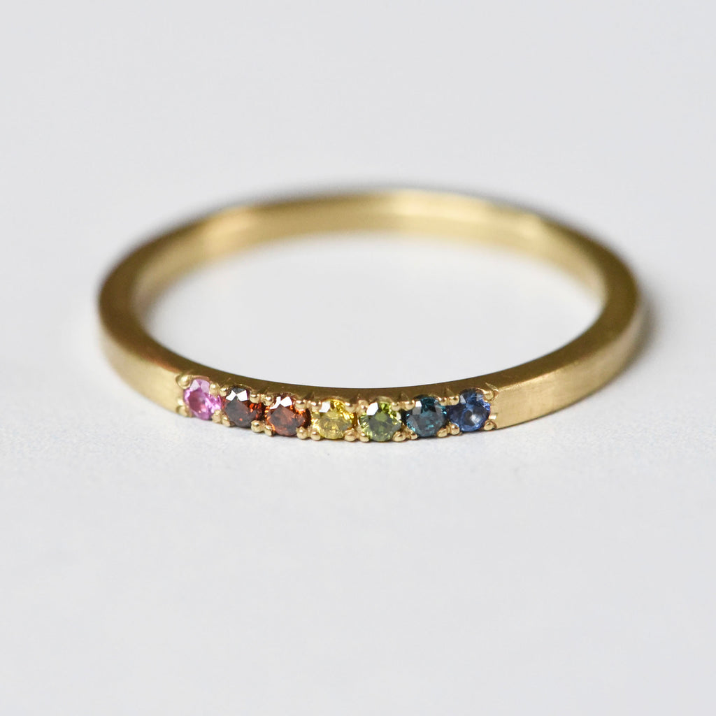 Rainbow diamond pave 18k yellow gold ring in a size 7.