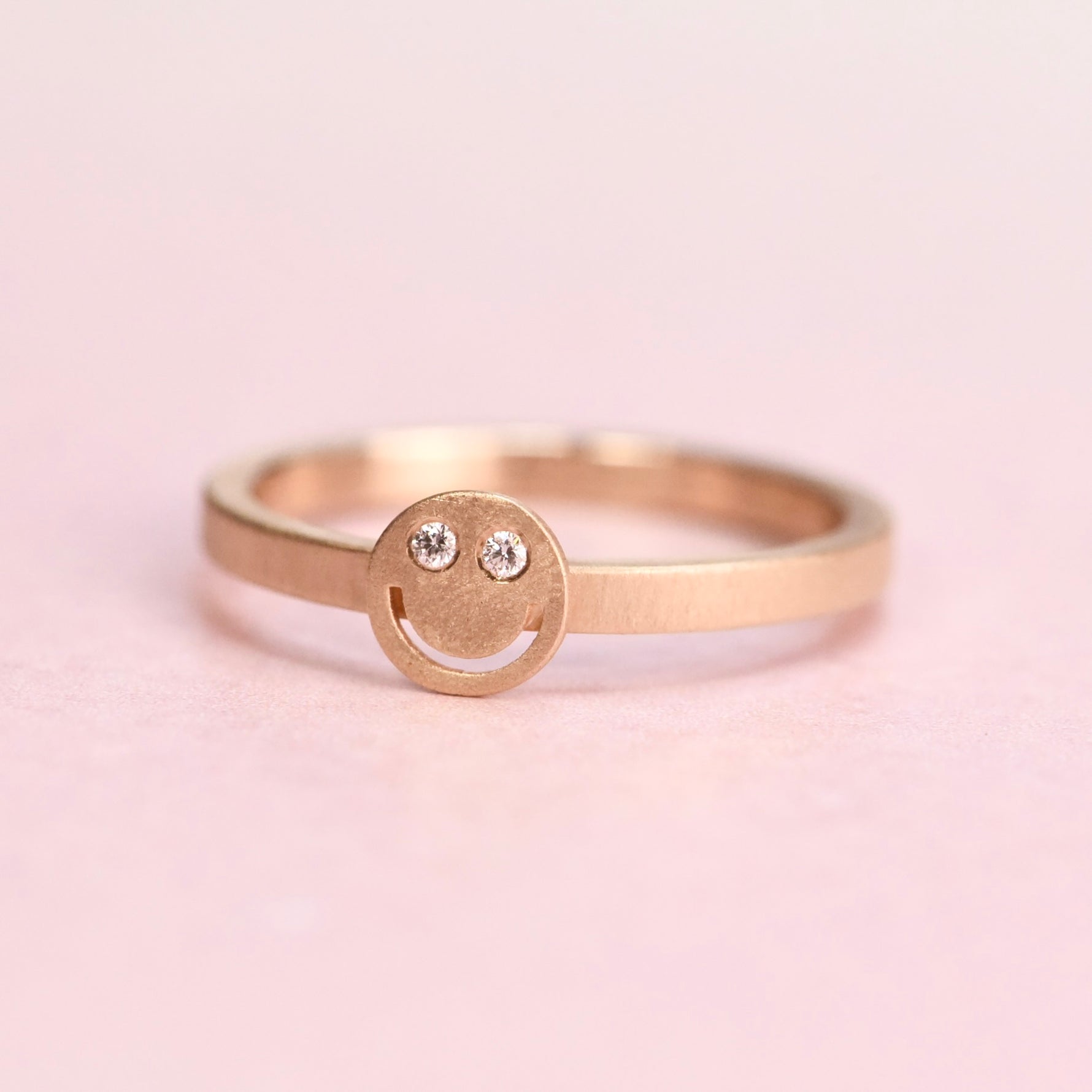 Handmade 10 K yellow gold “Smiley Face” ring size 7 set with diamonds by Corkie Bolton Jewelry, Rhode Island.