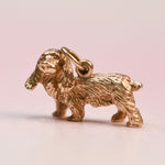 Vintage 14k yellow gold three-dimensional cocker spaniel charm before restoration, shown without the beret or diamond eyes