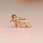 Vintage 14k yellow gold three-dimensional cocker spaniel charm with a hand fabricated rose gold beret and burnt orange diamond eyes
